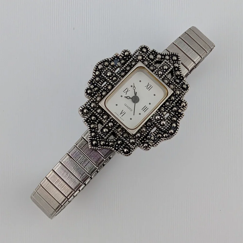 Avon silver tone